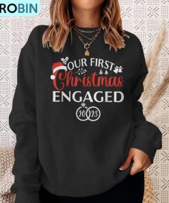 our-first-christmas-engaged-2023-christmas-couple-matching-ugly-christmas-sweatshirt-4