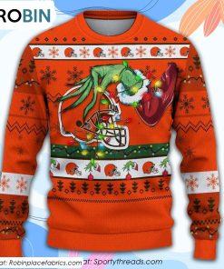 The Grinch Holding Cleveland Browns Design Ugly Christmas Sweater