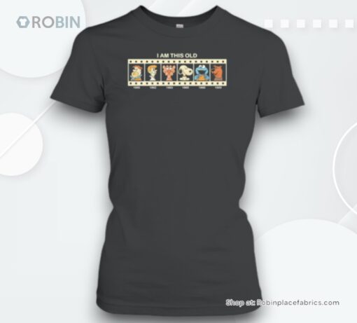 I Am This Old Flintstone 1960 George Jetson 1962 The Pink Panther 1963 Snoopy 1965 Cookie Monster 1966 And Scooby Doo 1969 Unisex Shirt