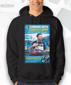 Ryan Nielsen Wearing Cooking With Coach Camp Shirt